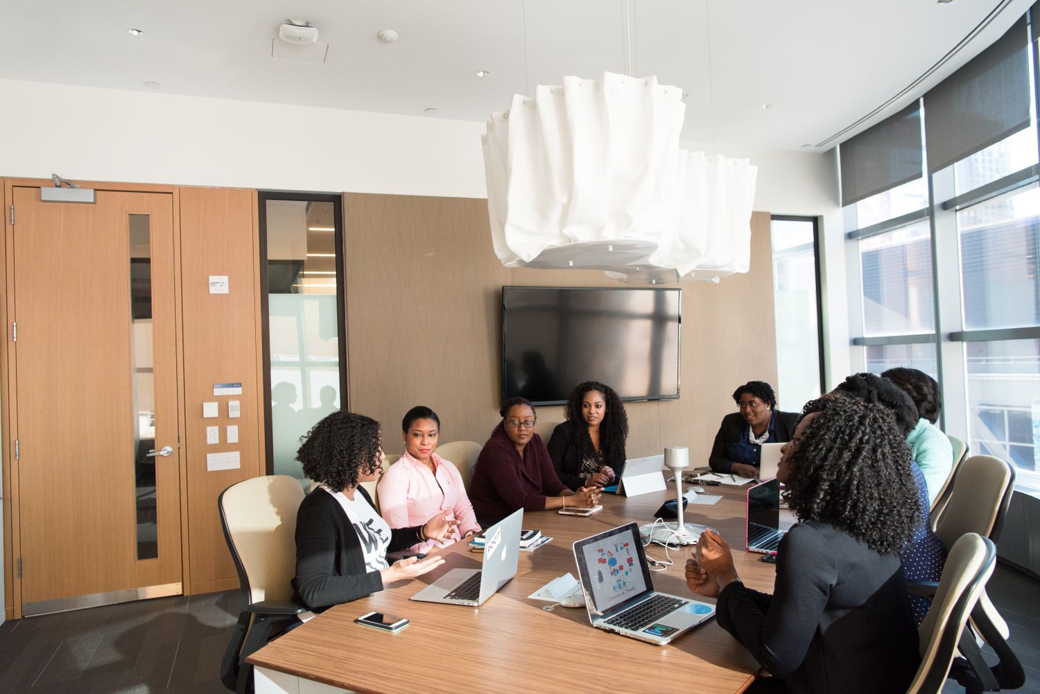 A team of professionals in a boardroom meeting